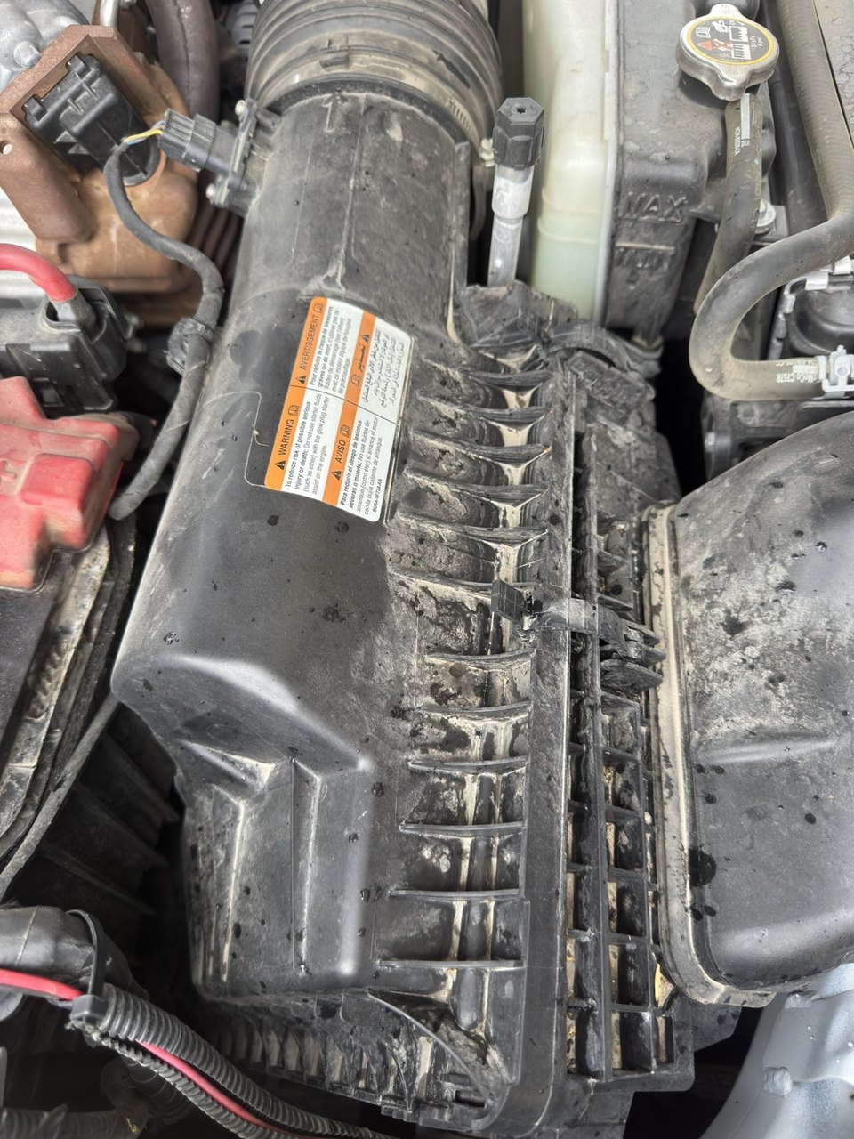 Actual Ford F-550 6.7L engine air filter housing photographed for KingKits fitment research