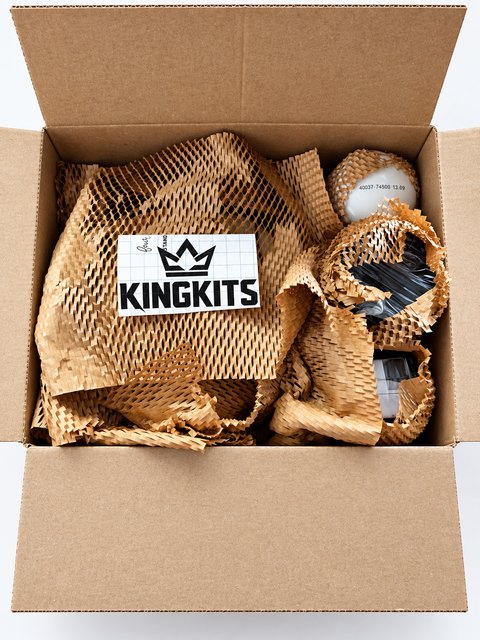 Open KingKits box with filters cushioned in honeycomb paper and a branded insert